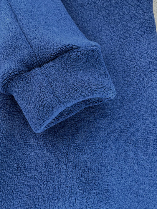 Warm stretchy blue fleece fabric.